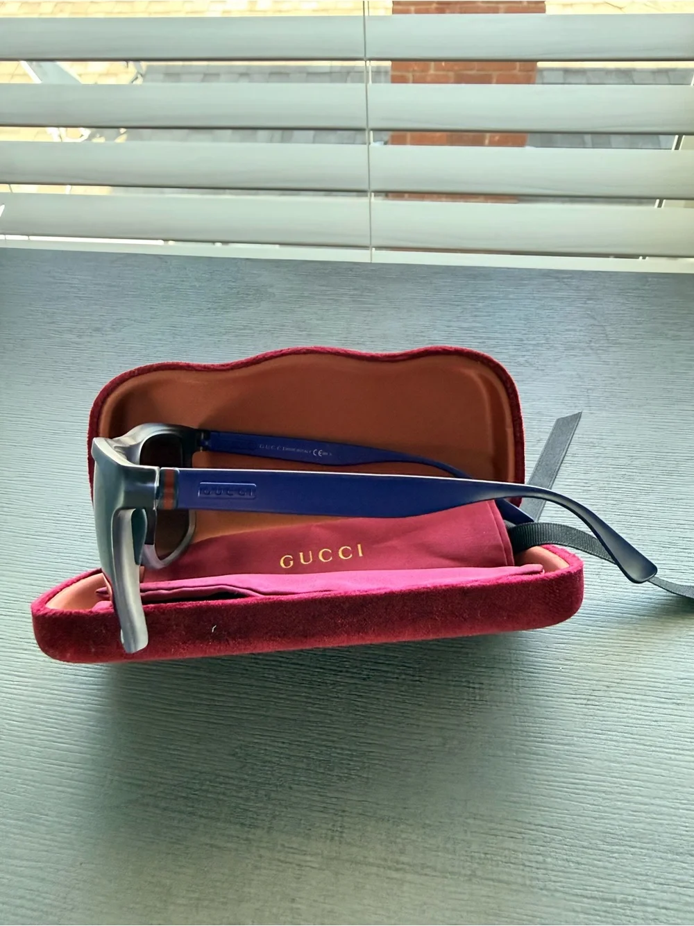Gucci Black Frame Sunglasses with blue sides and Dark Lenses and Maroon Case